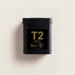 Black T2 Matcha powdered green tea tin with gold label on an off-white background