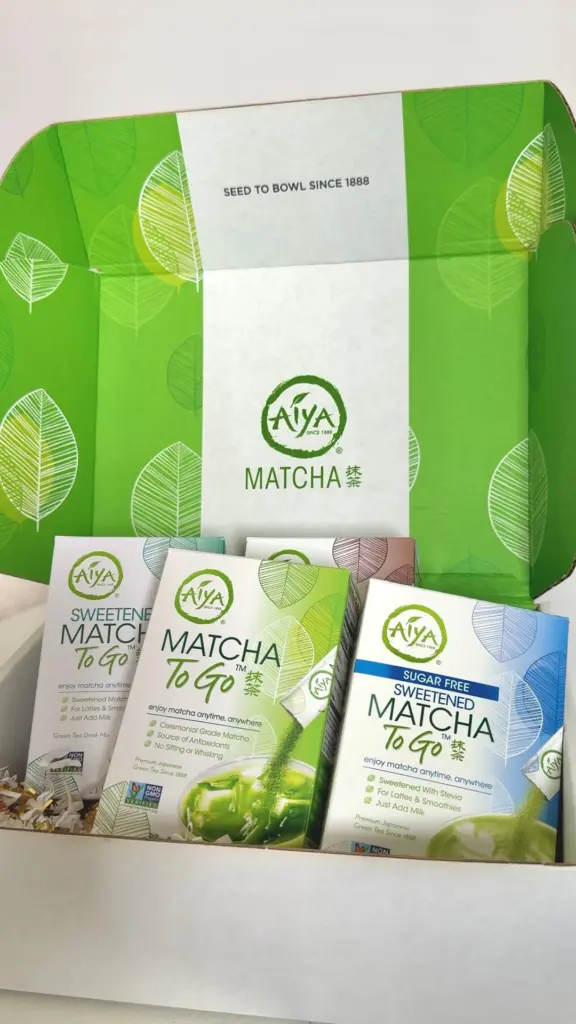 Open green Aiya box displaying several varieties of Matcha To Go