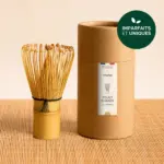 Anatae bamboo chasen beside its cylindrical brown container