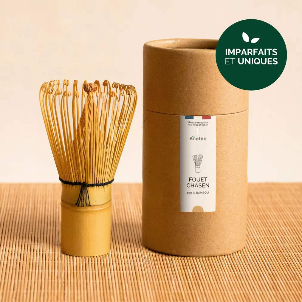 Anatae bamboo chasen beside its cylindrical brown container