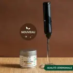 Anatae ceremonial matcha tin beside black handheld electric frother