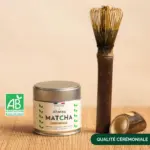 Anatae ceremonial matcha tin beside long bamboo chasen and scoop