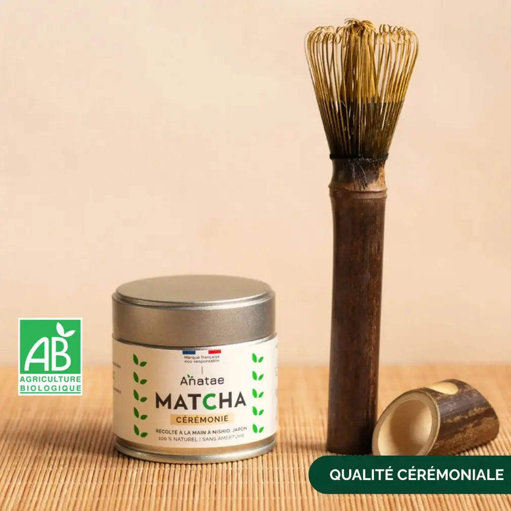 Anatae ceremonial matcha tin beside long bamboo chasen and scoop