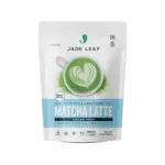 Front of a Jade Leaf Sugar-Free Matcha Latte Mix pouch with a green latte and heart-shaped foam art