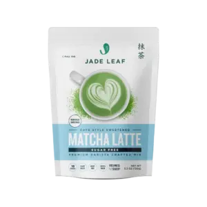 Front of a Jade Leaf Sugar-Free Matcha Latte Mix pouch with a green latte and heart-shaped foam art