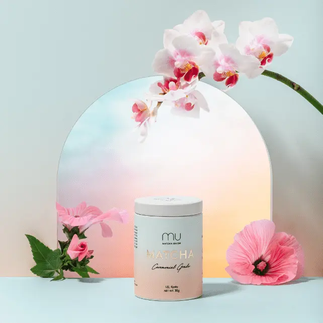 Matcha Union Ceremonial Matcha 30g tin arranged with pink and white flowers