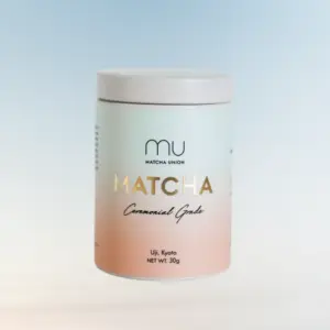 Front view of a Matcha Union Ceremonial Grade matcha tin with a pale blue and pink label