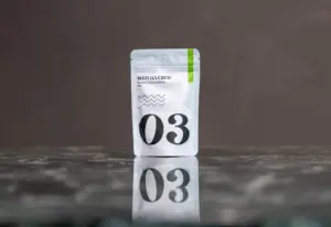 White Matcha Crew No. 03 40 g matcha pouch reflected on a dark polished surface