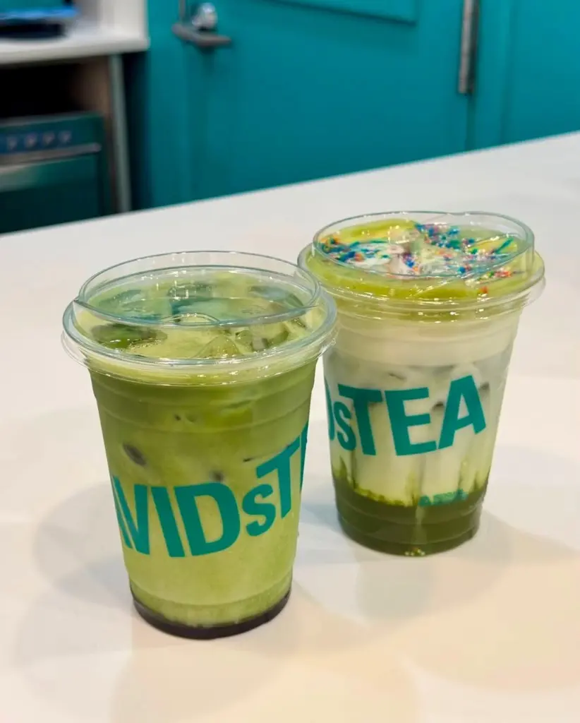 Two green iced drinks in clear David's Tea cups