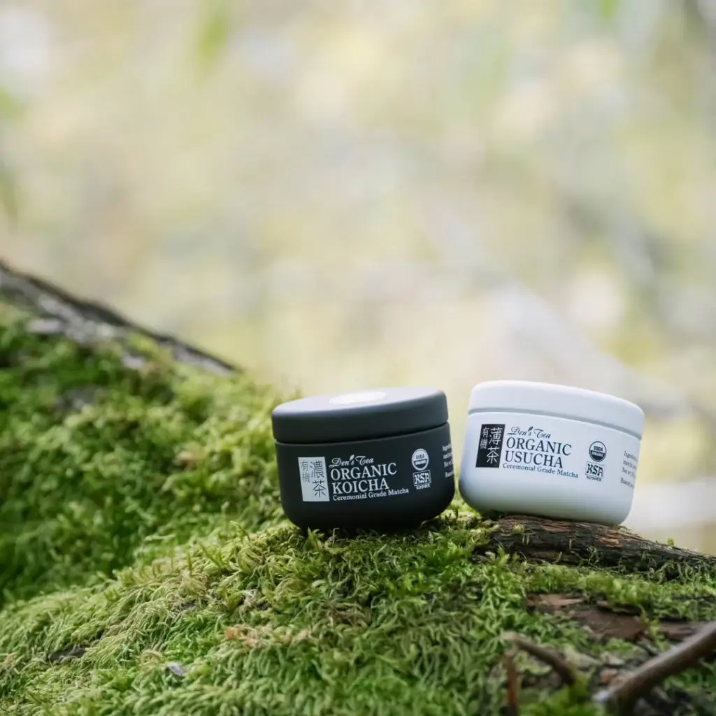 Den’s Tea Organic Koicha and Organic Usucha matcha containers on green moss