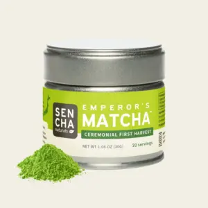 Sencha Naturals Emperor's Matcha 30 g tin beside a small mound of green matcha powder
