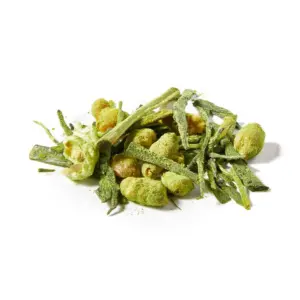 Close-up of green tea leaves and toasted rice coated with matcha powder