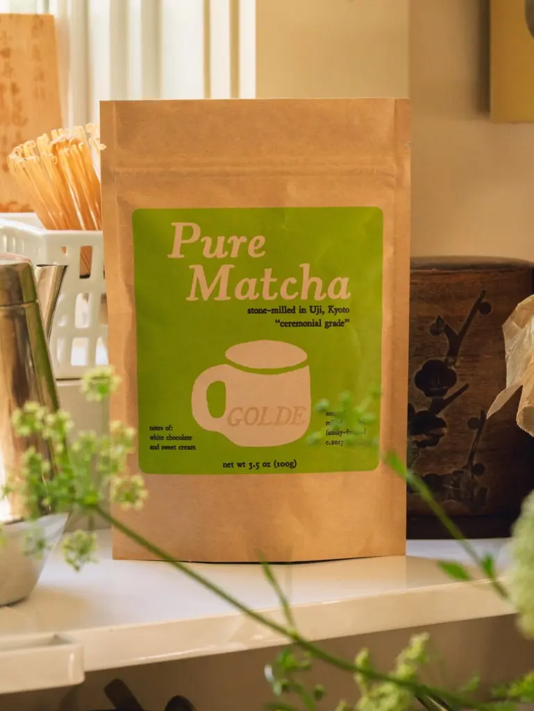 Brown Golde Pure Matcha pouch with a green label on a counter