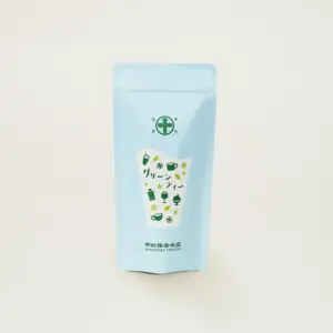 Light blue Nakamura Tokichi sweetened matcha green tea mix pouch with green cup and glass illustrations