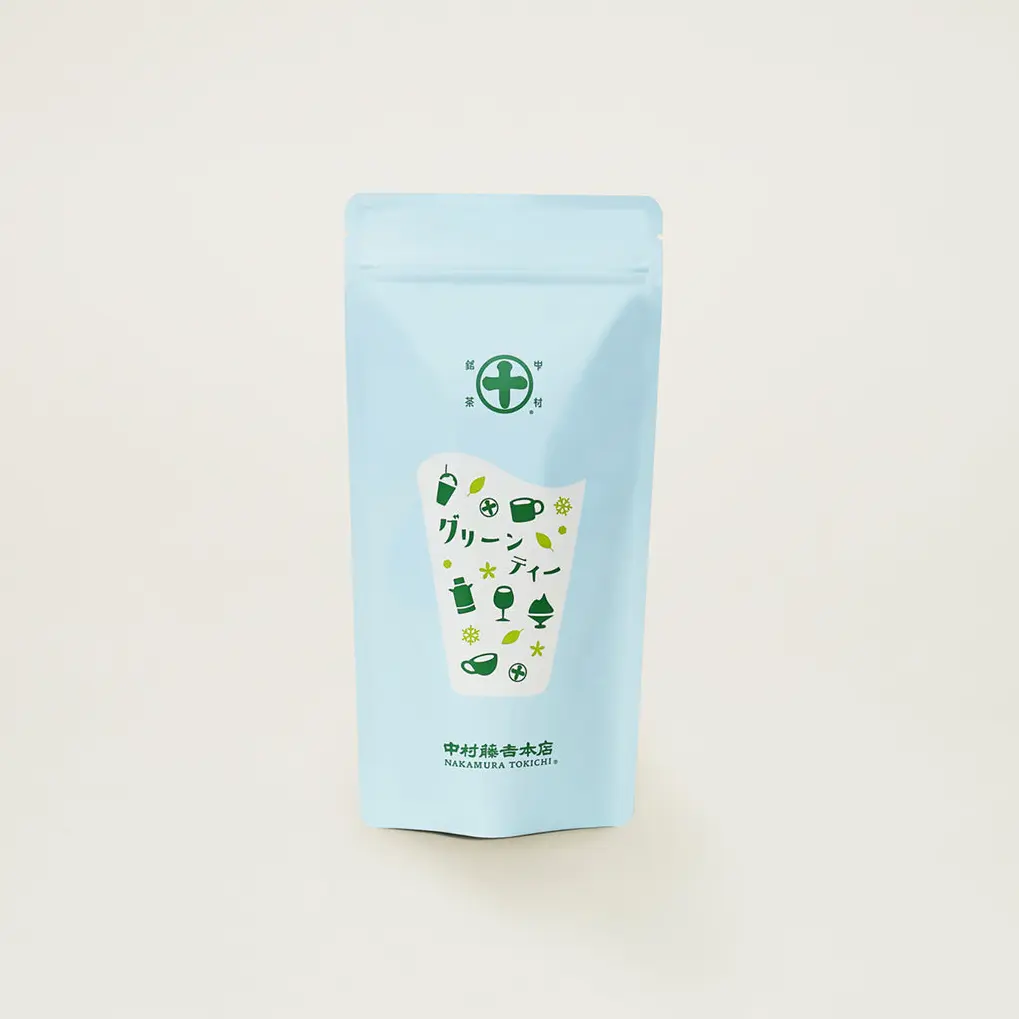 Light blue Nakamura Tokichi sweetened matcha green tea mix pouch with green cup and glass illustrations