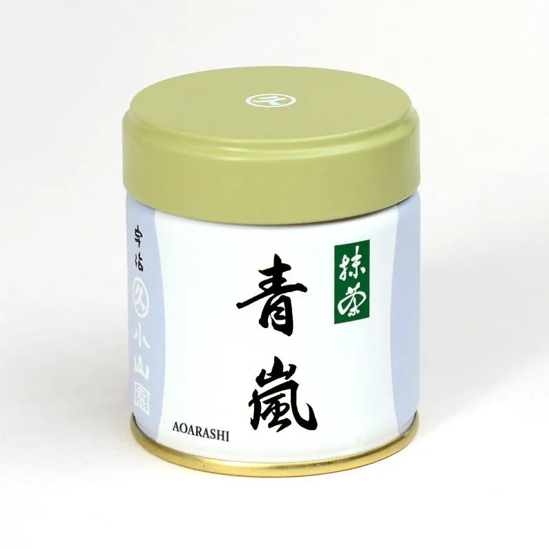 Small white and pale blue matcha tin with olive-green lid, labeled 青嵐 AOARASHI in black brushed script
