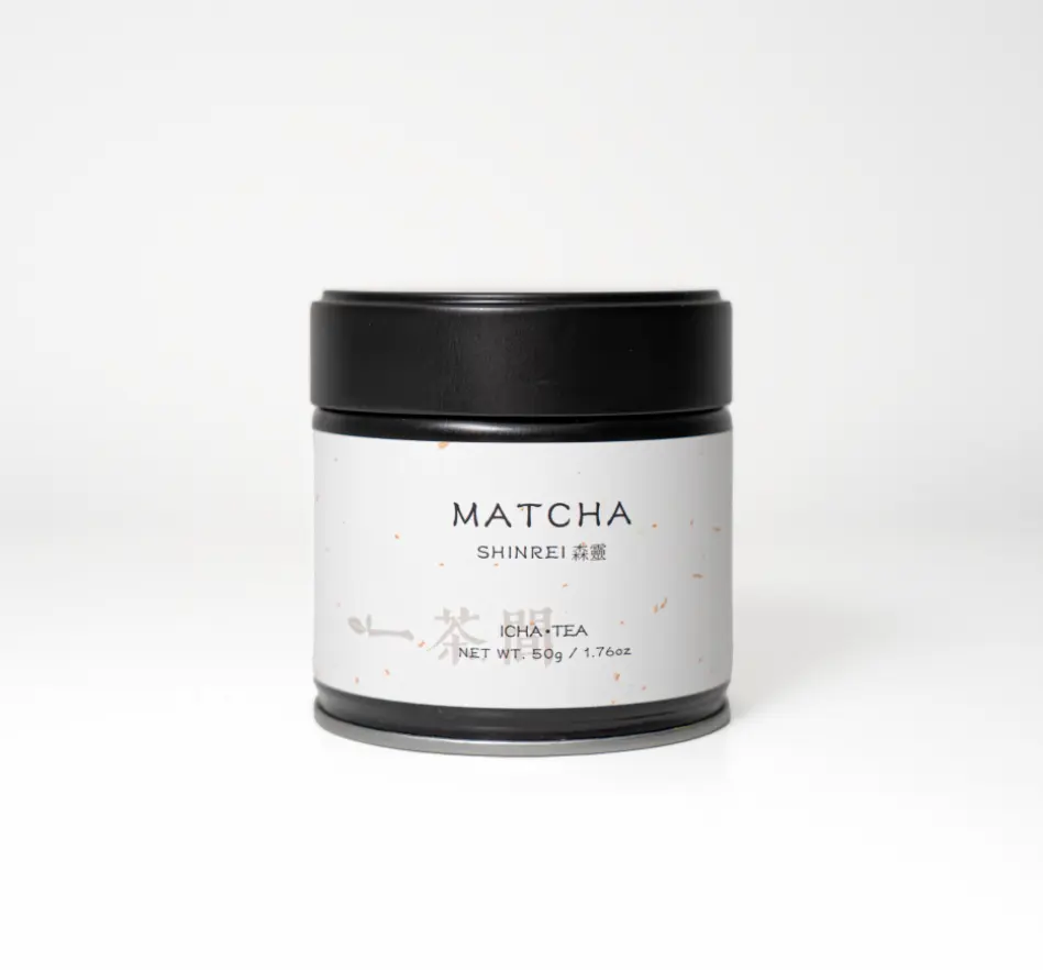 Black matcha tin with cream label reading MATCHA SHINREI, ICHA TEA, 50g / 1.76oz, on a white background