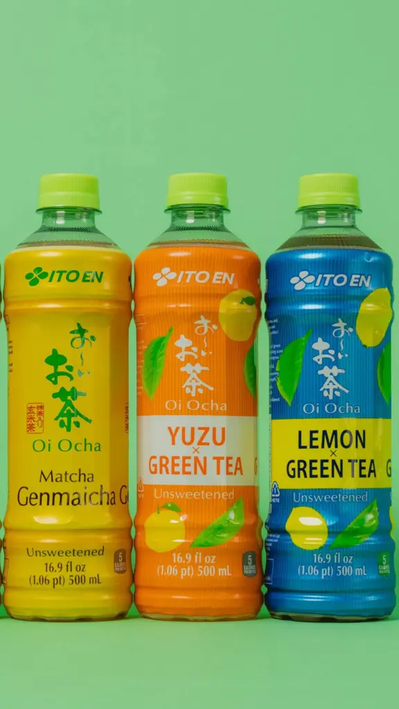Three Ito En Oi Ocha tea bottles in yellow, orange, and blue packaging