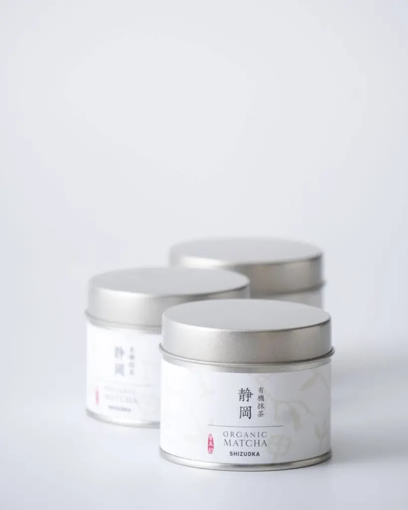 Three silver tins labeled Organic Matcha Shizuoka