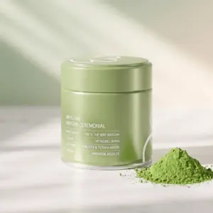 Green Le Miyazaki ceremonial matcha tin beside a mound of green matcha powder