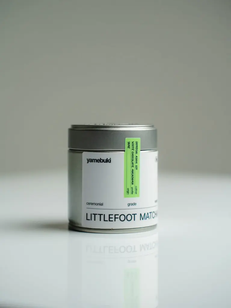 Silver Littlefoot Matcha tin labeled yamebuki on a reflective white surface