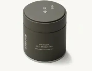 Dark cylindrical Nakamura Tokichi Ato Mukashi matcha can with a fitted lid