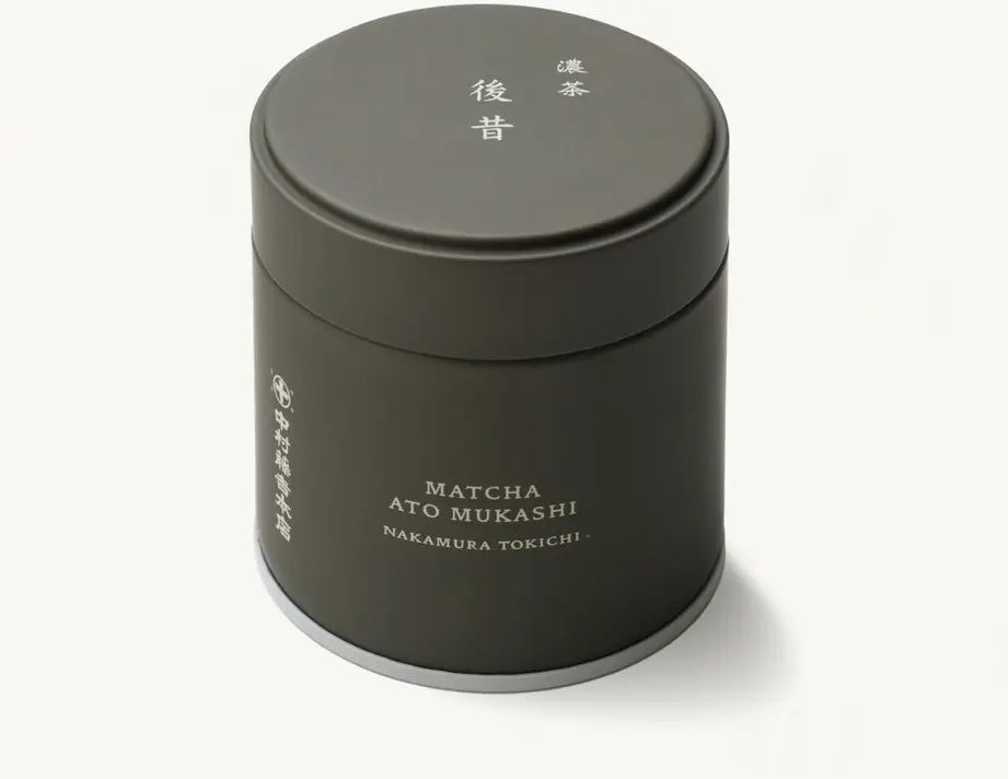 Dark cylindrical Nakamura Tokichi Ato Mukashi matcha can with a fitted lid