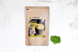 Kumiko Matcha Barista pouch beside a small mound of green powder