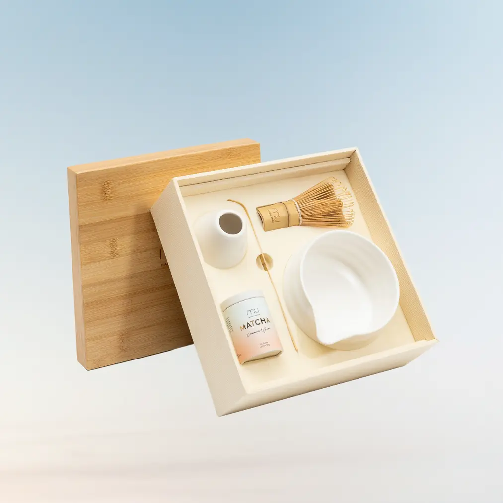 Open Matcha Ceremony Set with matcha tin, bamboo whisk and scoop, white bowl, and whisk holder
