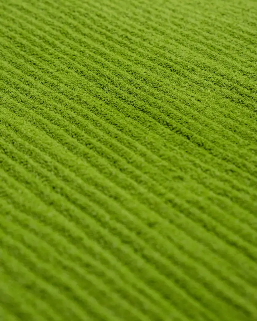 Close-up of finely textured bright green matcha powder
