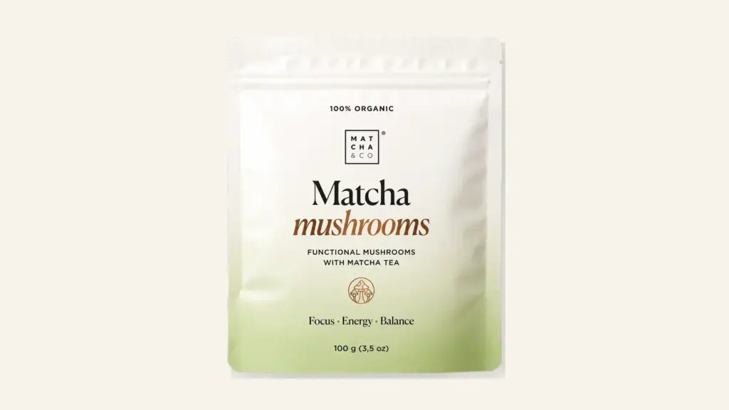 Complete front view of the Matcha & CO Matcha Mushrooms pouch on a warm ivory background