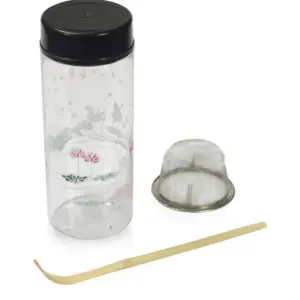 Clear floral tea shaker with black lid, metal mesh sieve, and bamboo chashaku scoop