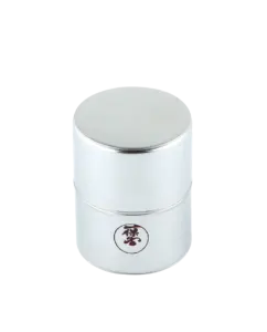 Cylindrical Ippodo Tea matcha sieve with a fitted lid and logo on the front