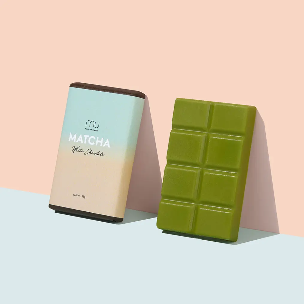 Green segmented Matcha White Chocolate bar beside its Matcha Union package