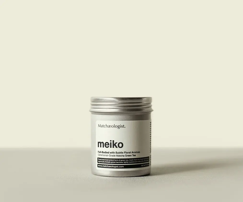 Silver Matchæologist Meiko ceremonial matcha tin with front label on a pale background