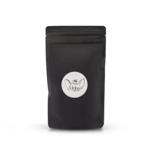 Front view of a black resealable Moba Matcha pouch with a round white logo label