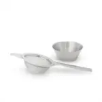 Fine-mesh matcha sifter with a long handle beside a small bowl