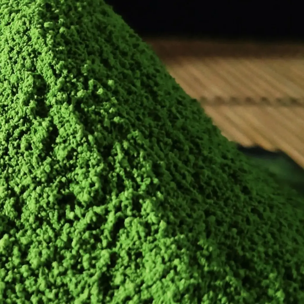 Close-up of a mound of bright green matcha powder