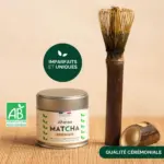 Anatae ceremonial matcha tin beside long bamboo chasen and holder