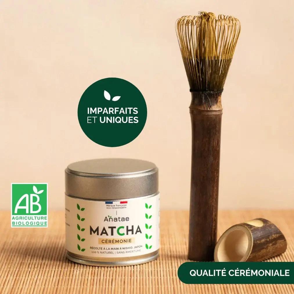 Anatae ceremonial matcha tin beside long bamboo chasen and holder