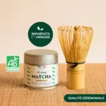 Anatae ceremonial matcha tin beside short bamboo chasen on bamboo mat