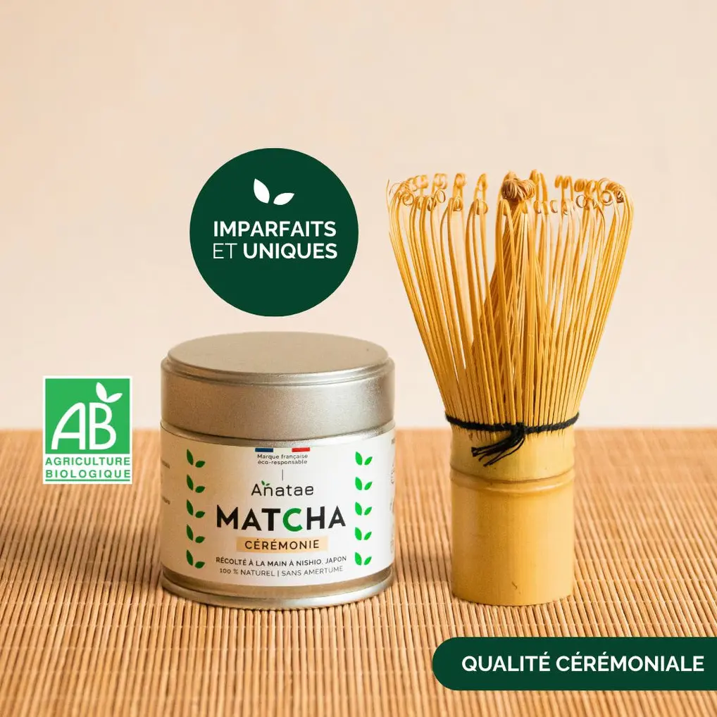 Anatae ceremonial matcha tin beside short bamboo chasen on bamboo mat