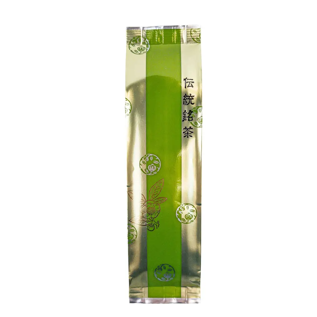 Tall silver and green tea package with Japanese text and leaf illustrations