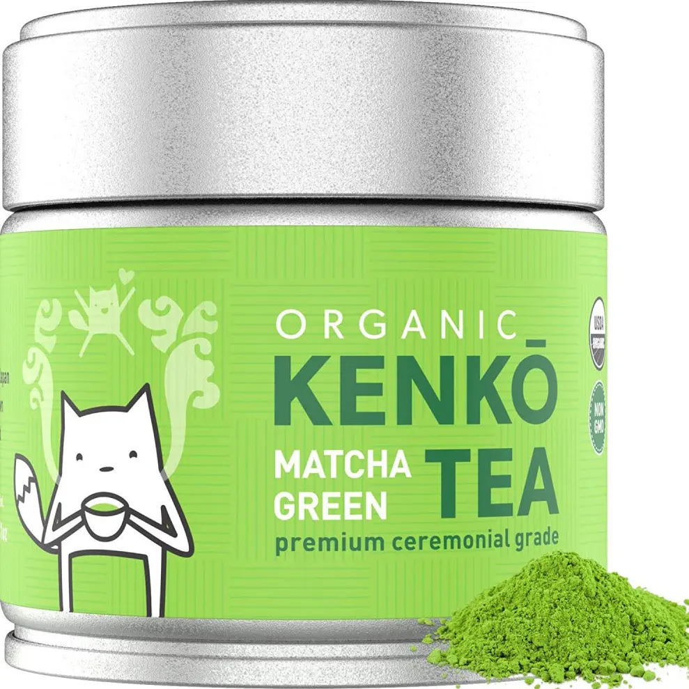 Kenko organic ceremonial grade matcha tin beside a mound of green tea powder