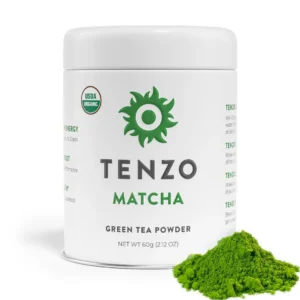 White Tenzo Matcha tin, 60g green tea powder, beside a mound of bright green matcha powder