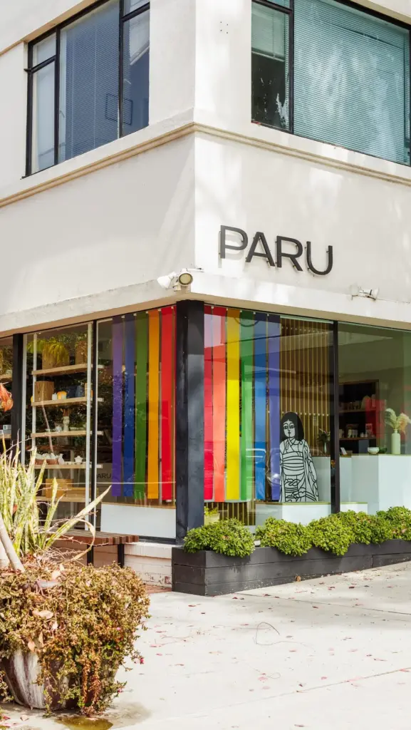 PARU storefront with colorful vertical panels across the corner windows