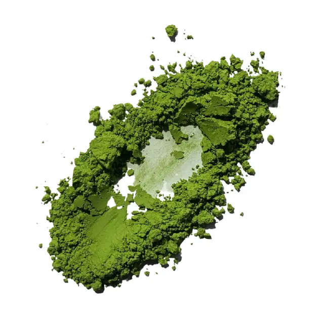 Green matcha powder spread in a loose oval on a white background