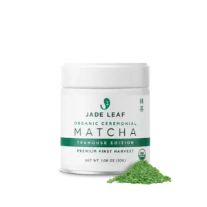 White Jade Leaf Teahouse Edition matcha tin with a small pile of green powder
