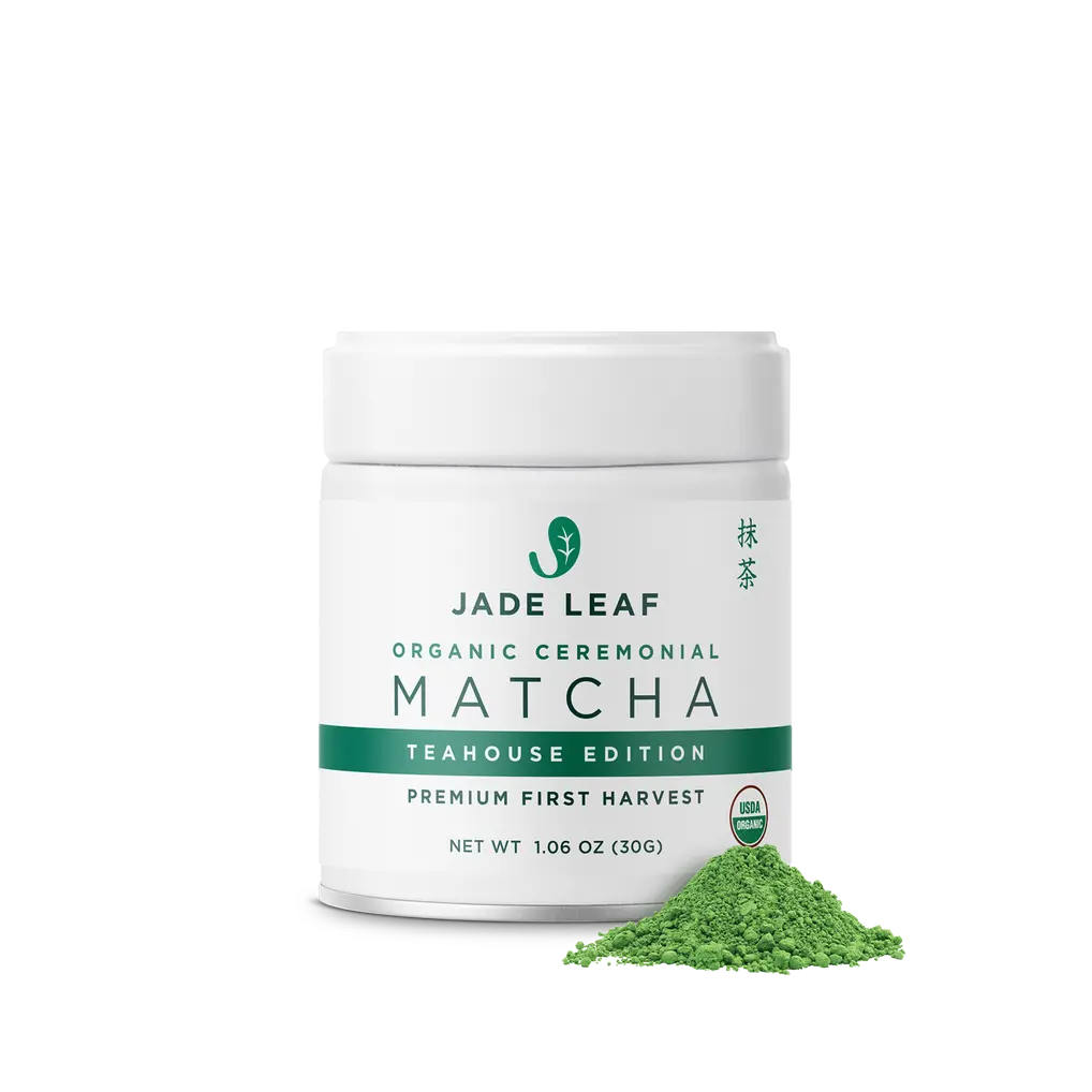 White Jade Leaf Teahouse Edition matcha tin with a small pile of green powder