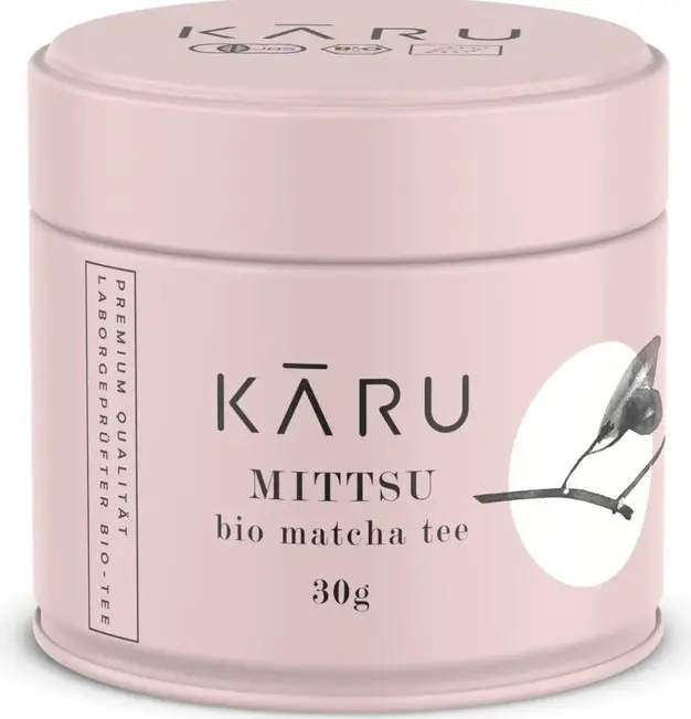 Pink 30 g tin of Kāru Mittsu bio matcha tea with black lettering and a leaf illustration